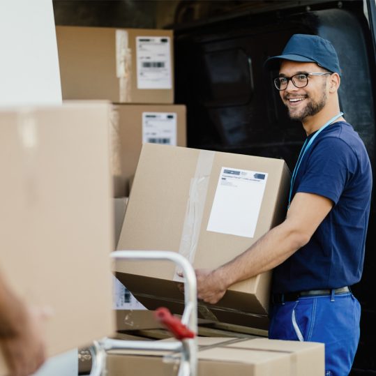 a staff carrying bulk orders for delivery